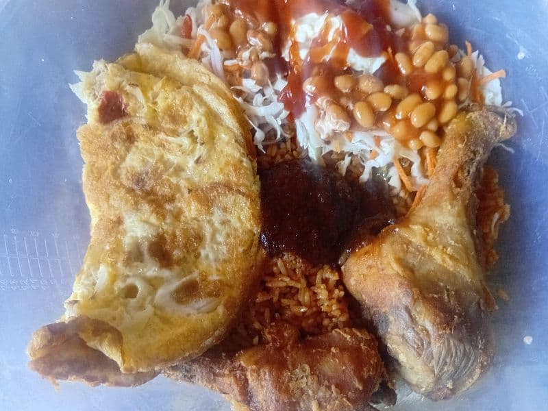 Jollof rice with chicken and fried egg