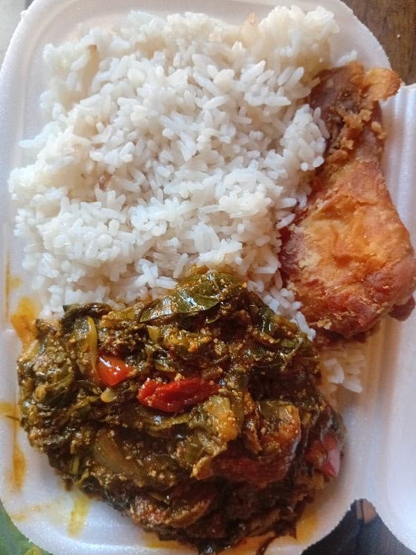 plain rice and kontomire with chicken /fish